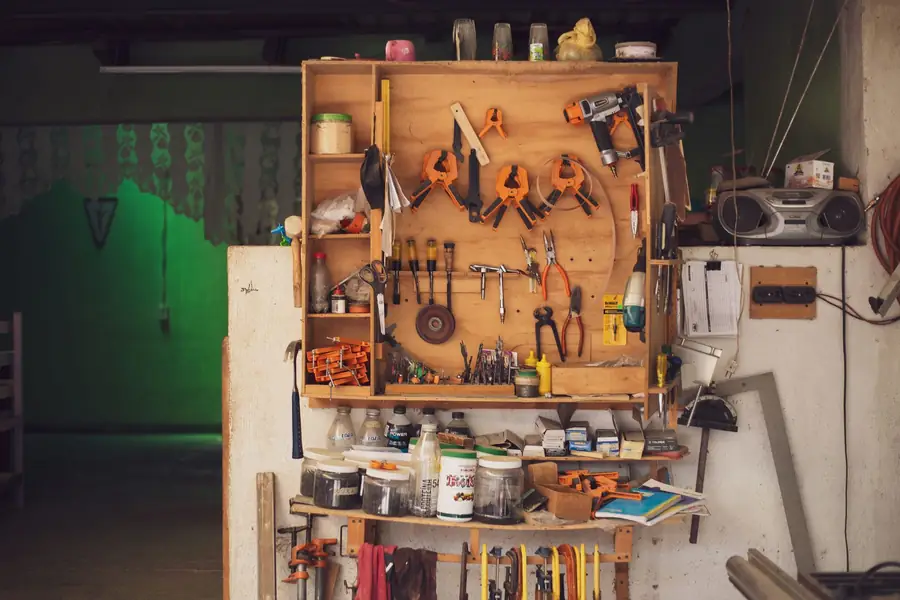 An organised workbench with hand tools laid out.